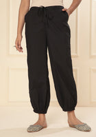 Black embroidered lace cuff pants